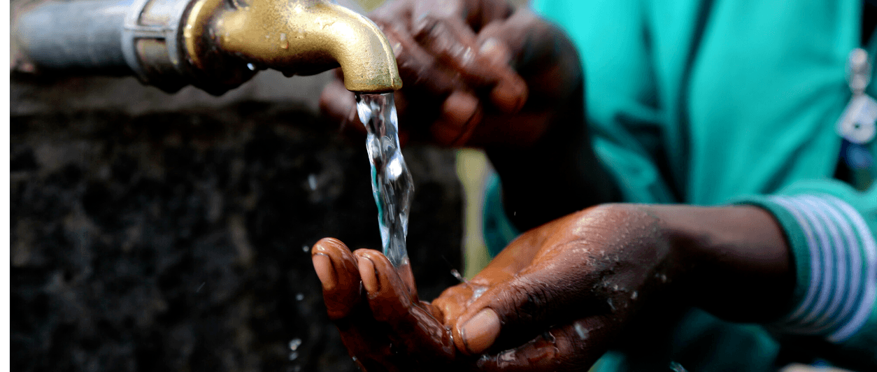 Hands under a tap with clean water flowing