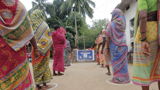 Women queue for sanitary kits in India