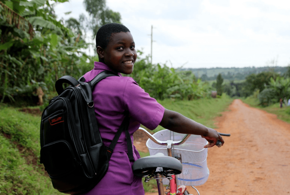 Nawalat smiles with her bicycle
